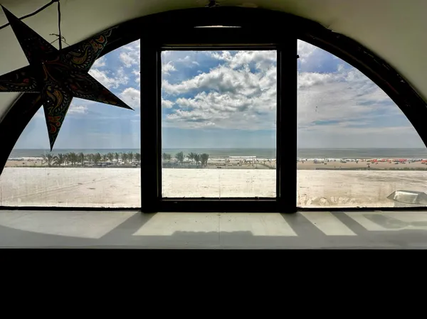a view of a room that has a large window