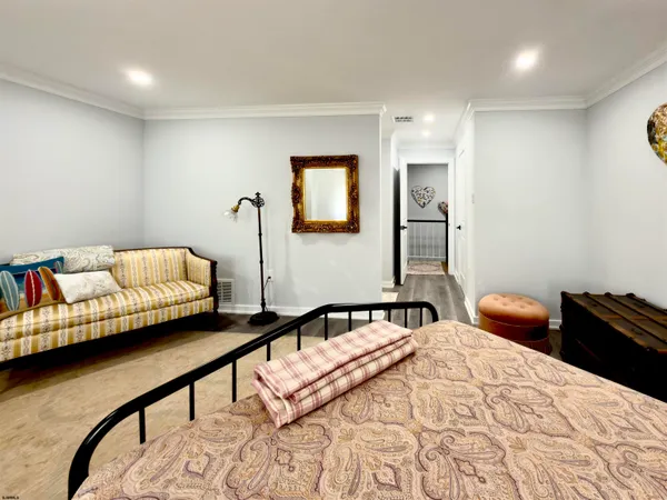 a bedroom with bed and a window