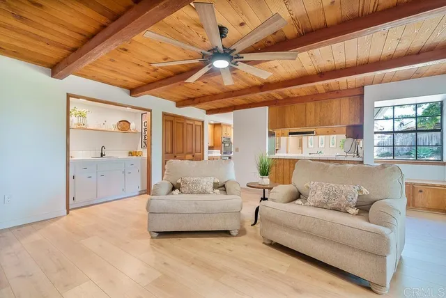 a room with pool table and window