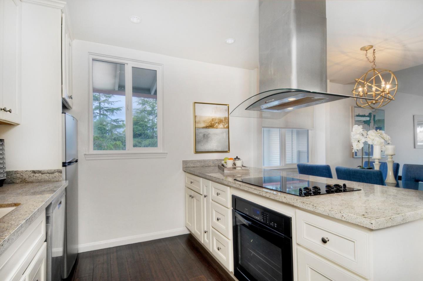a kitchen with a sink and a stove