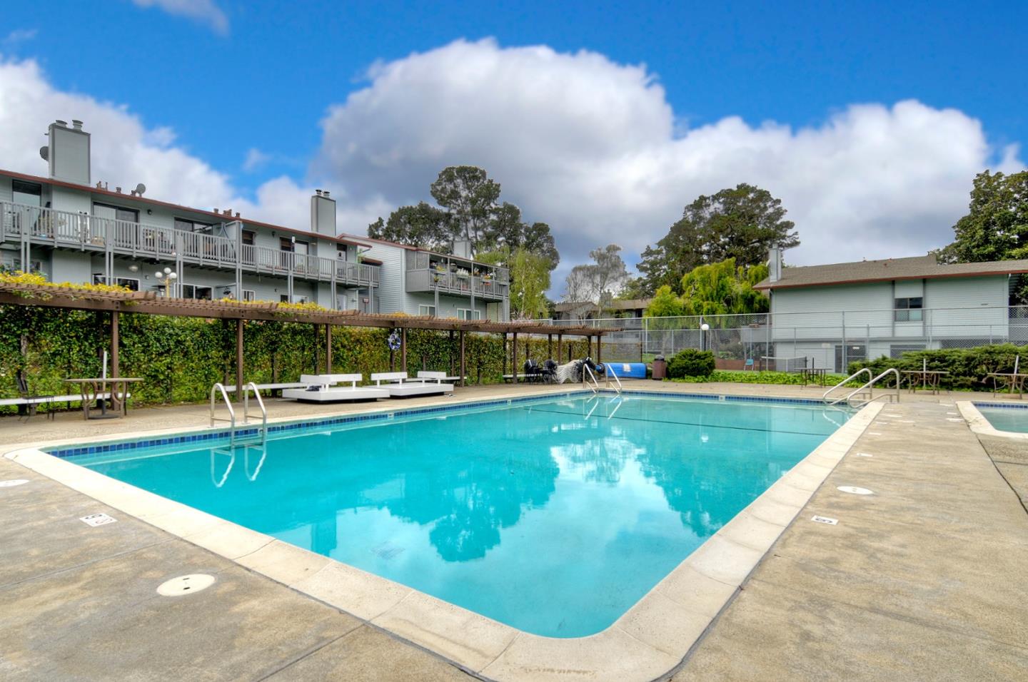 4106 George Avenue, Unit 2 San Mateo, CA 94403 - Photo 17 of 20 a view of a swimming pool with outdoor seating