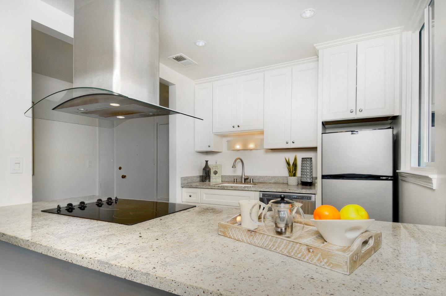 4106 George Avenue, Unit 2 San Mateo, CA 94403 - Photo 2 of 20 a kitchen with a sink a stove and a refrigerator
