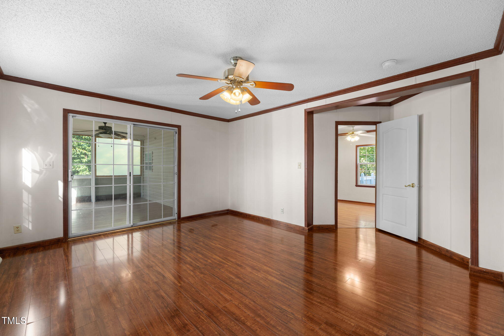 538 Allie Clay Road Roxboro, NC 27573 - Photo 13 of 37 an empty room with wooden floor and a window