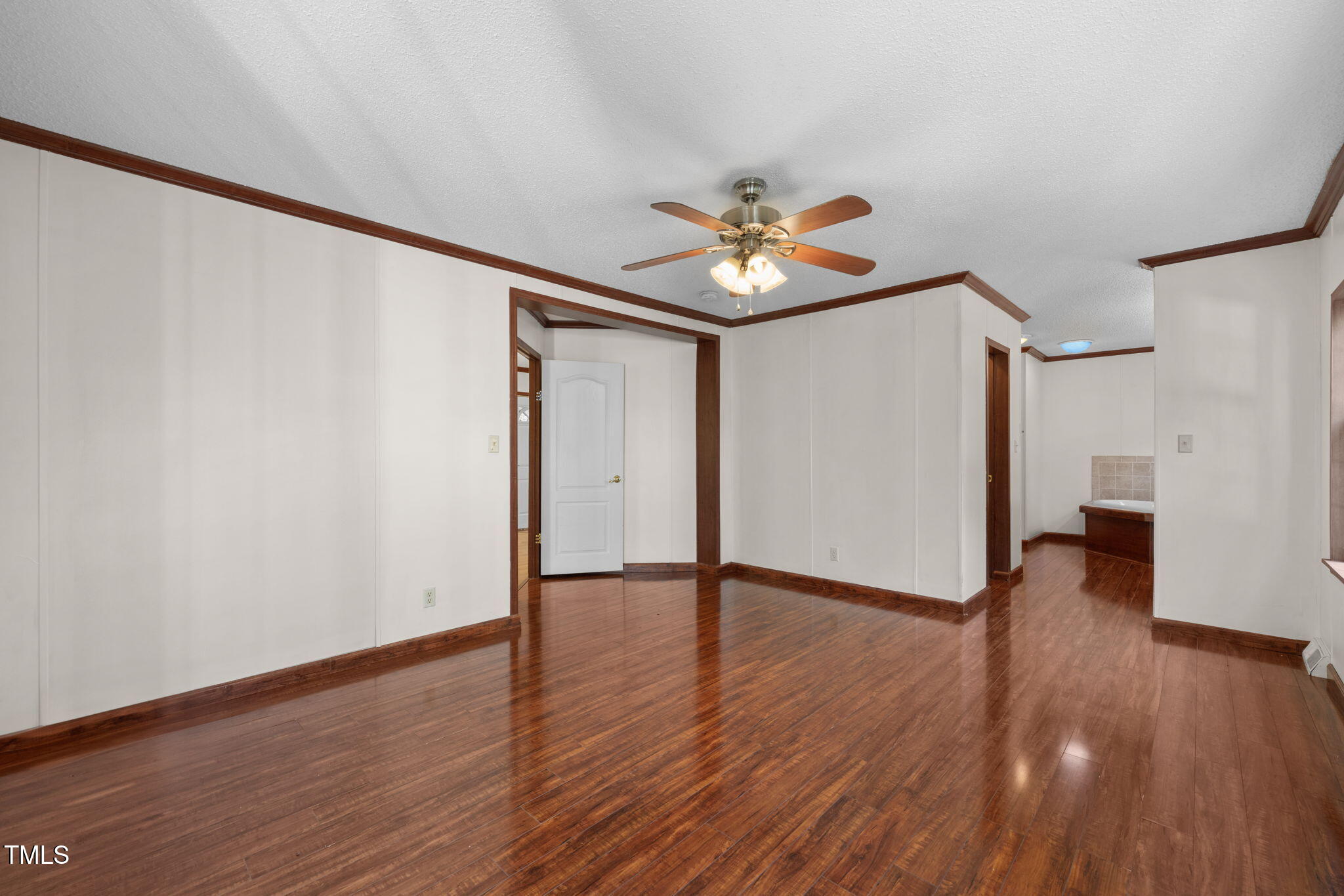 538 Allie Clay Road Roxboro, NC 27573 - Photo 14 of 37 a view of an empty room with a window and wooden floor
