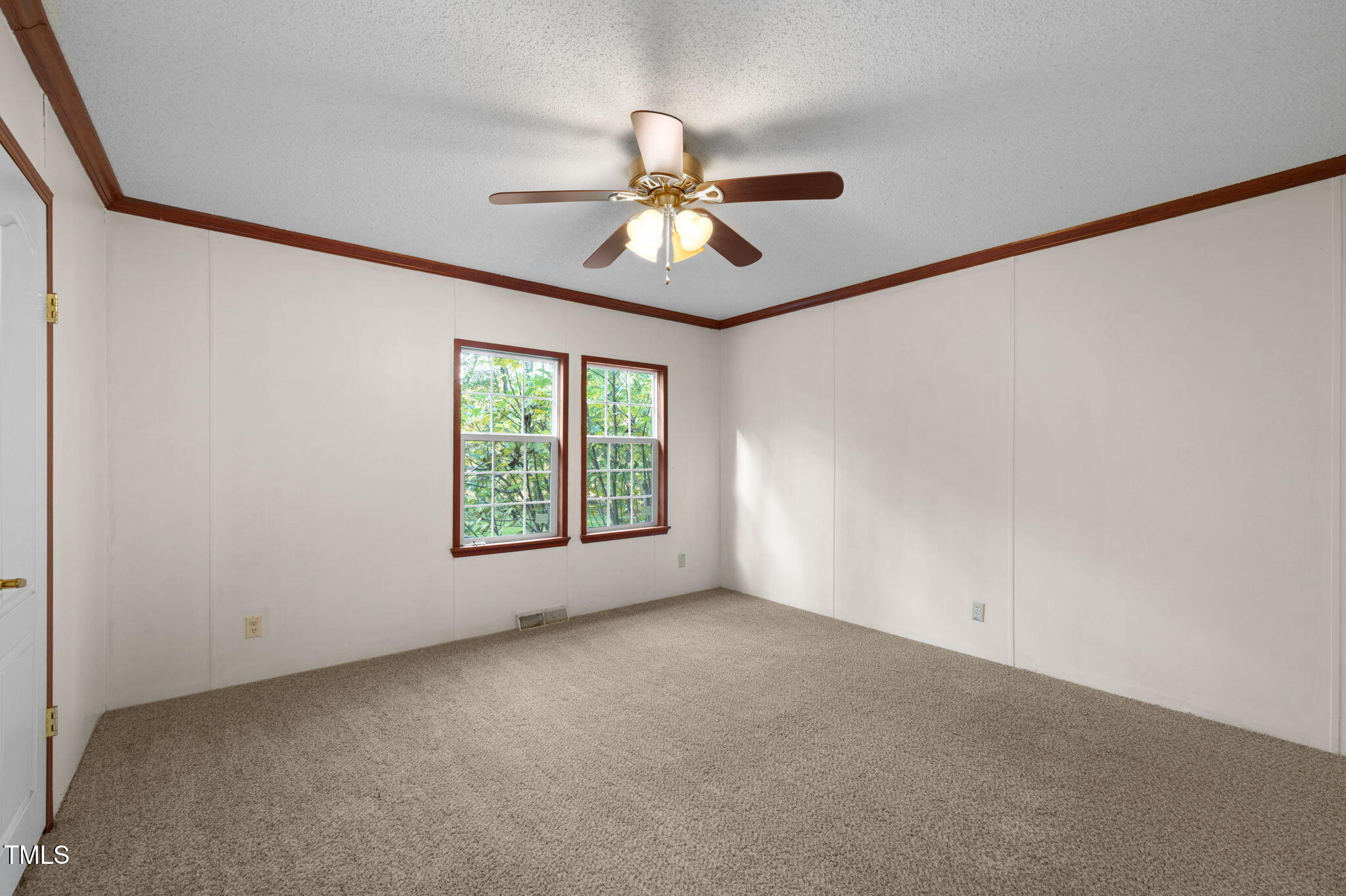 538 Allie Clay Road Roxboro, NC 27573 - Photo 21 of 37 a view of a room with windows and ceiling fan