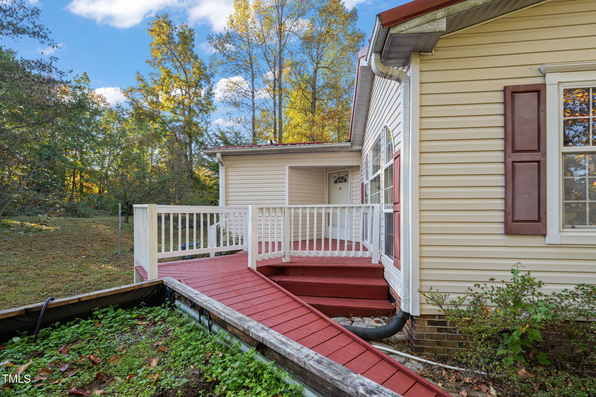 538 Allie Clay Road Roxboro, NC 27573 - Photo 27 of 37 a view of a wooden deck with a bench