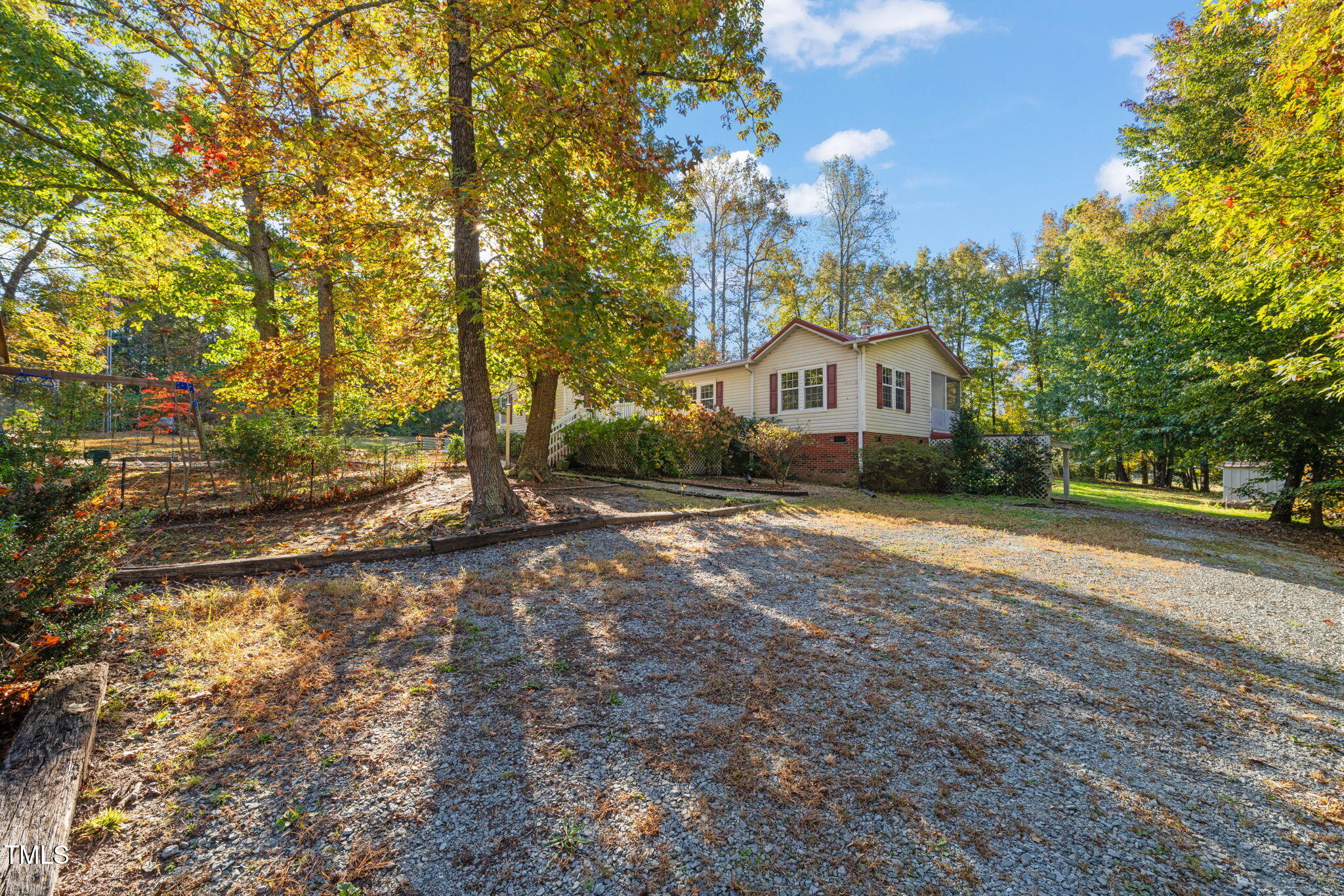 538 Allie Clay Road Roxboro, NC 27573 - Photo 29 of 37 a front view of a house with a yard and large trees