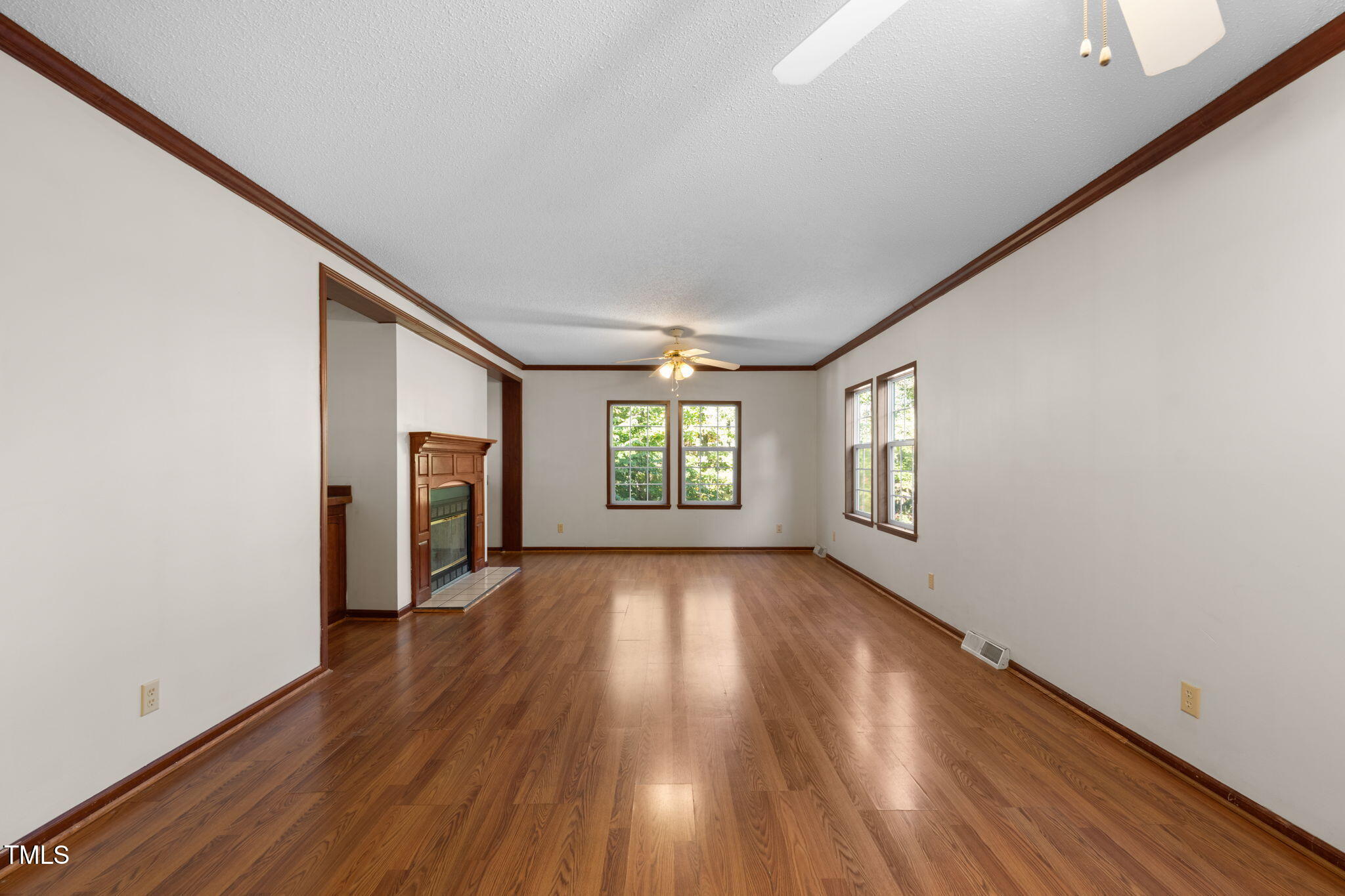 538 Allie Clay Road Roxboro, NC 27573 - Photo 3 of 37 a view of an empty room with wooden floor and a window