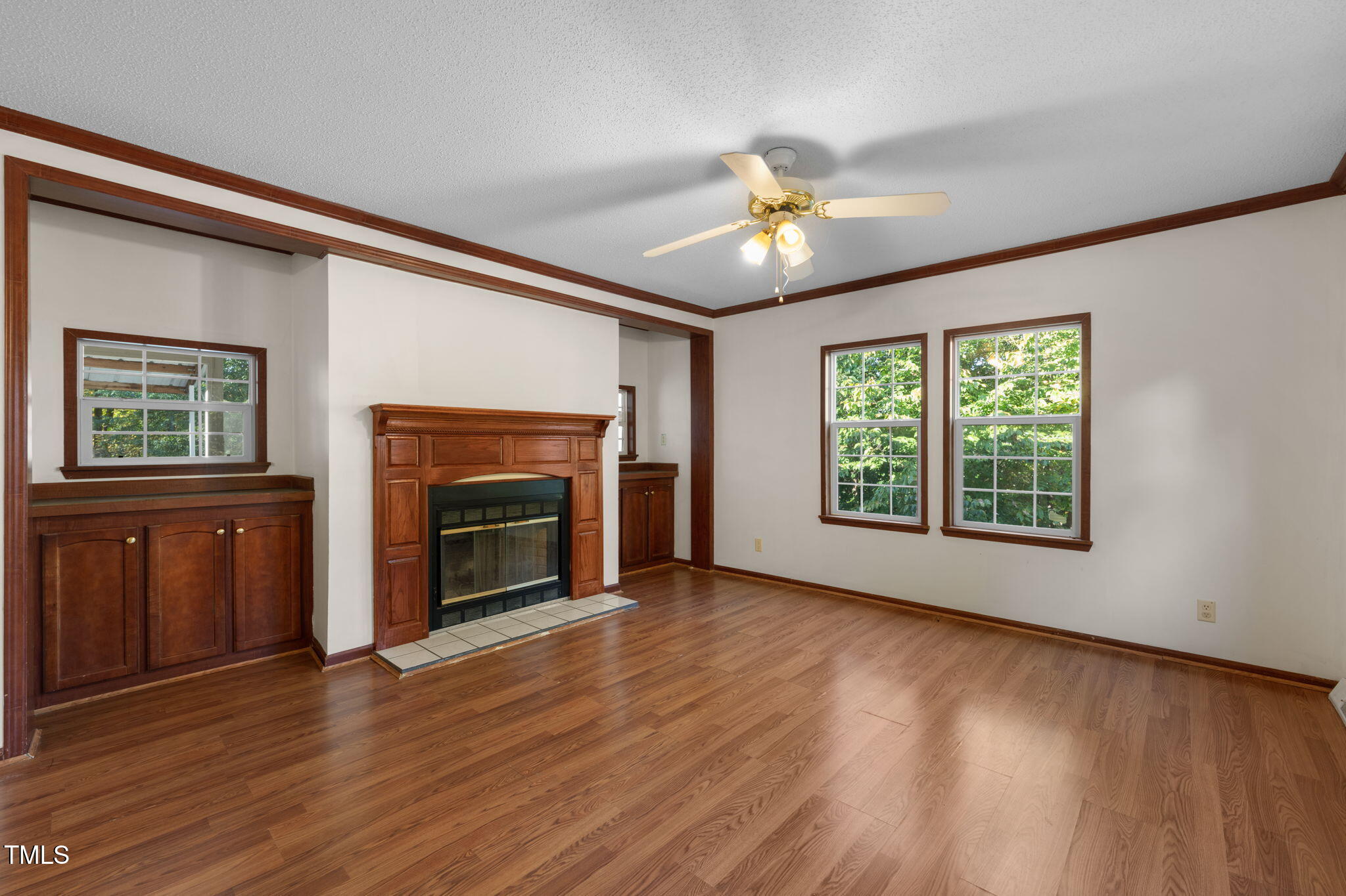 538 Allie Clay Road Roxboro, NC 27573 - Photo 4 of 37 a view of an empty room with a fireplace and a window