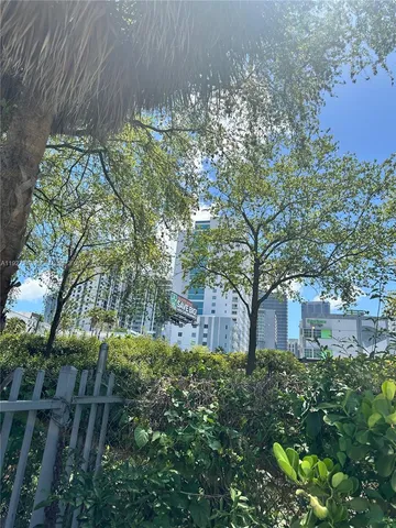 a aerial view of a house with an outdoor space and seating area