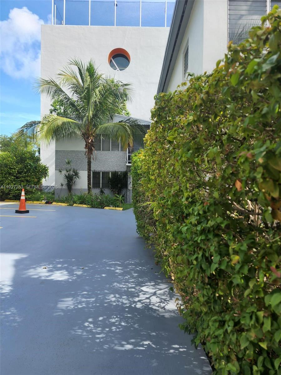 364 Southwest 11th Street Miami, FL 33130 - Photo 16 of 61 a front view of a house with a yard and garage