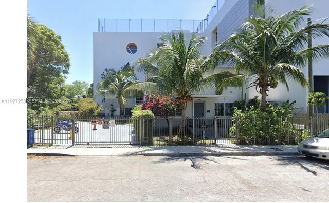 a front view of a house with tree s