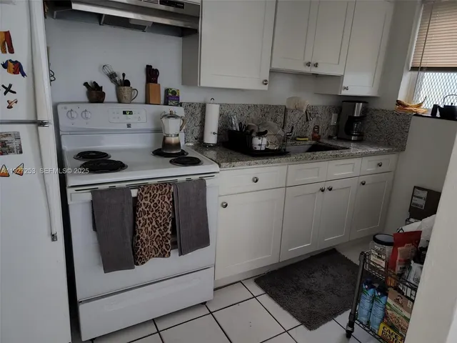 a room with furniture and a flat screen tv