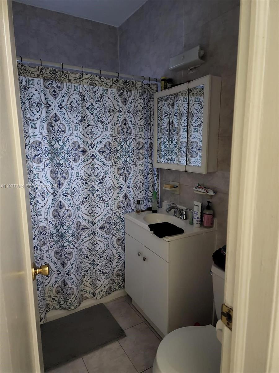 364 Southwest 11th Street Miami, FL 33130 - Photo 45 of 61 a bathroom with a sink toilet and shower