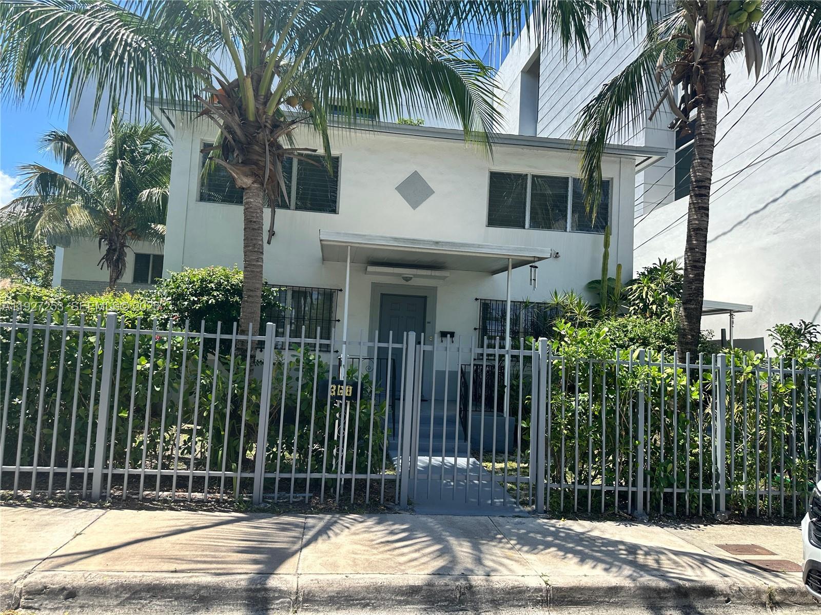 364 Southwest 11th Street Miami, FL 33130 - Photo 5 of 61 a front view of house with yard along with palm trees