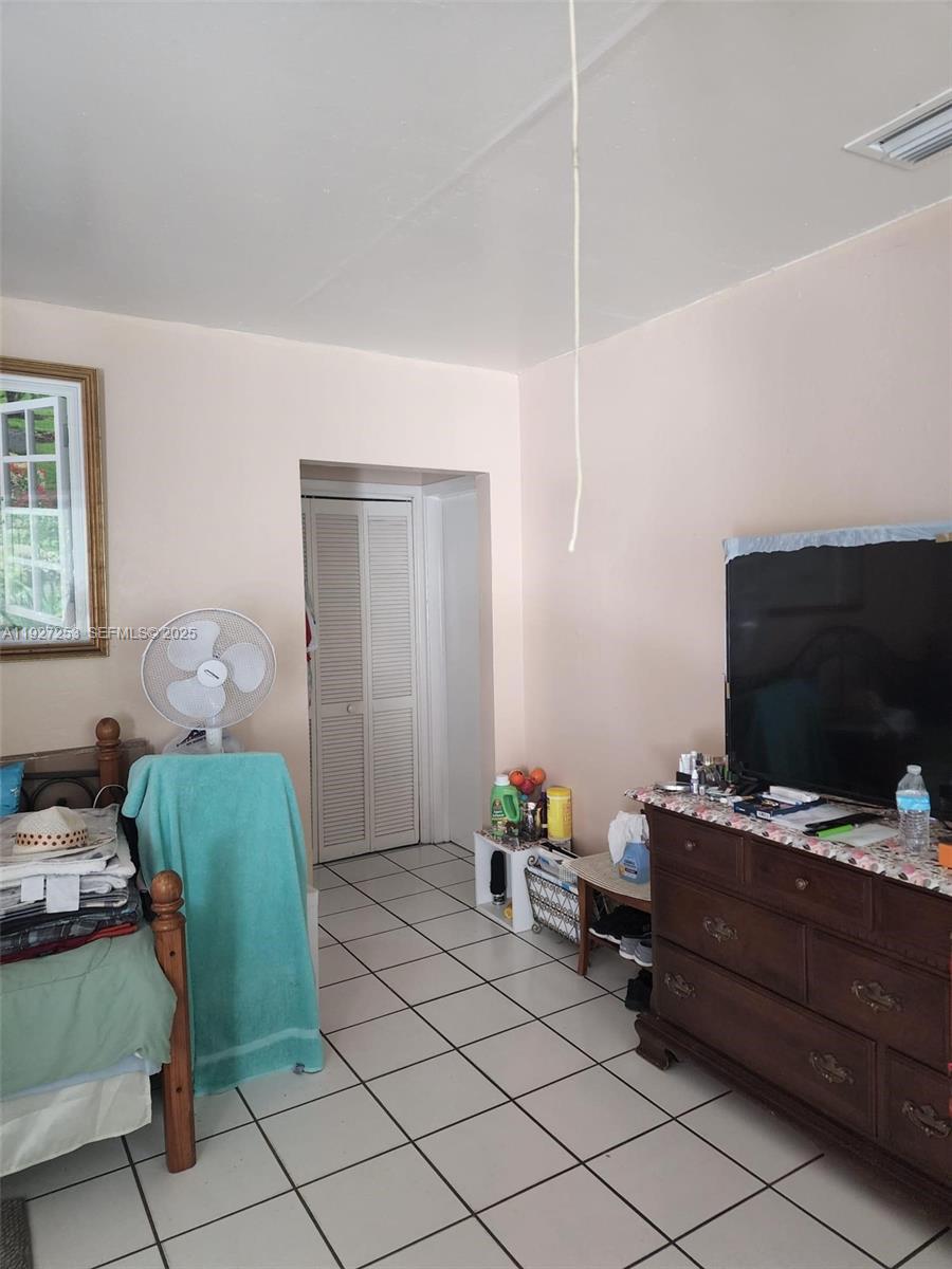 364 Southwest 11th Street Miami, FL 33130 - Photo 51 of 61 a room with furniture and a flat screen tv