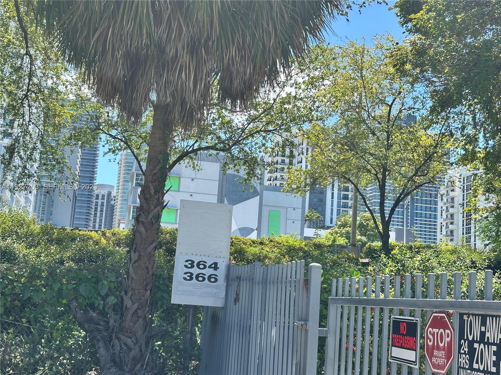 364 Southwest 11th Street Miami, FL 33130 - Photo 10 of 61 a view of a sign board with flower plants