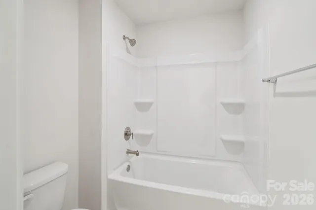 a close up of a bathtub curtain