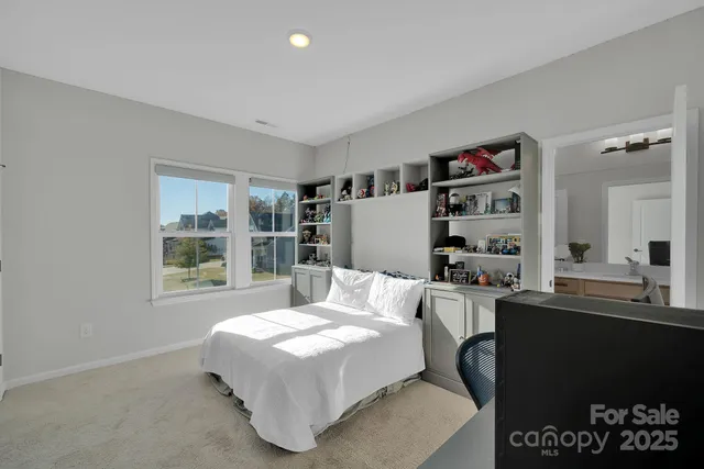 a bathroom with a tub a sink and mirror