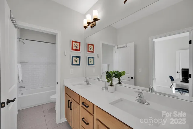 a bathroom with a window and a shower