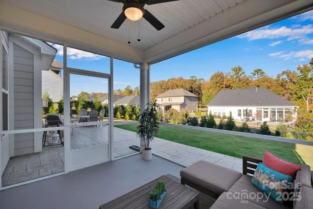 a view of a backyard with sitting area