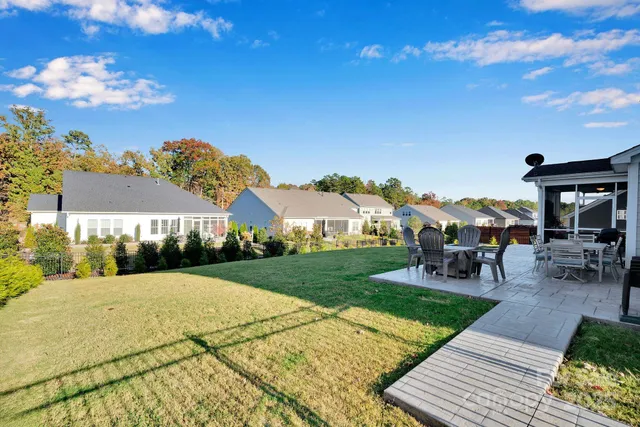 a view of a house with a big yard