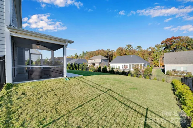 an aerial view of a house with a ocean view