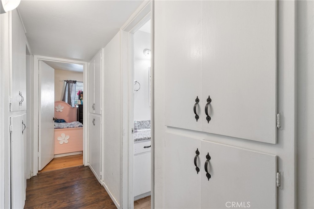304 Adams Street Taft, CA 93268 - Photo 16 of 28 a view of hallway with wooden floor