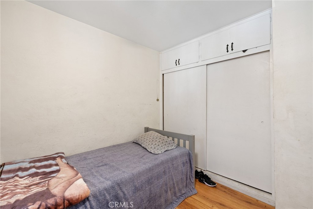 304 Adams Street Taft, CA 93268 - Photo 20 of 28 a bedroom with a bed and a window