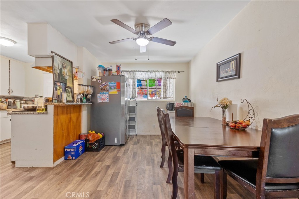 304 Adams Street Taft, CA 93268 - Photo 7 of 28 a view of a dining room with furniture and wooden floor