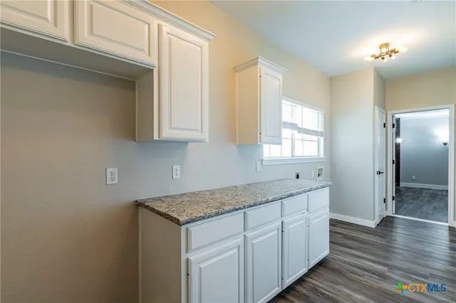 a view of a tree in front of a house