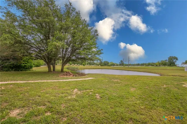 a view of a kitchen with a sink and a window