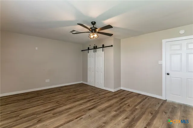 a view of a room with racks on the wall