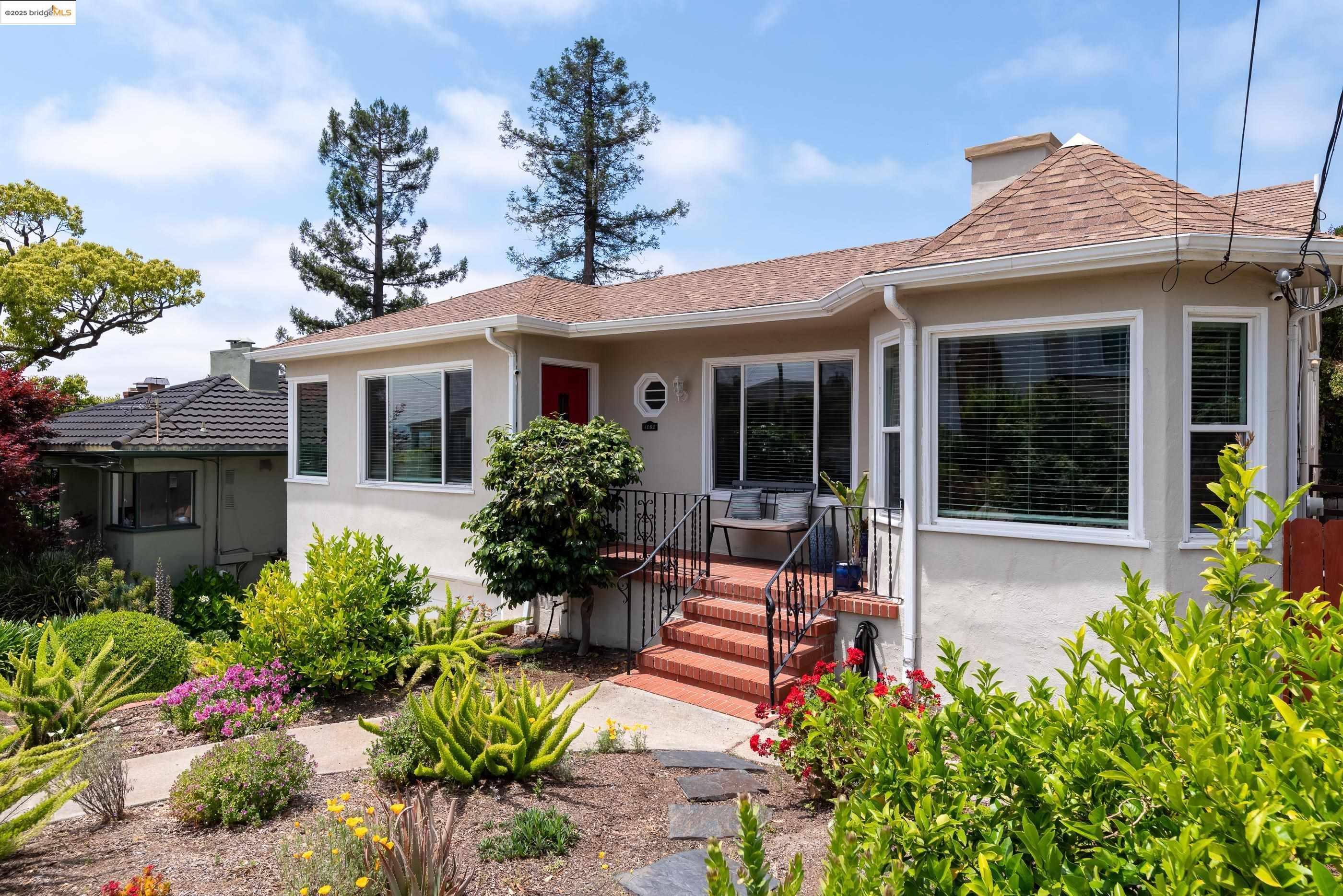 4151 Eastlake Avenue Oakland, CA 94602 - Photo 2 of 3 a front view of a house with a porch and furniture