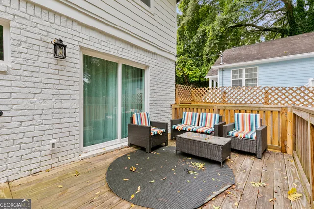 a backyard of a house with barbeque oven fire pit and bench