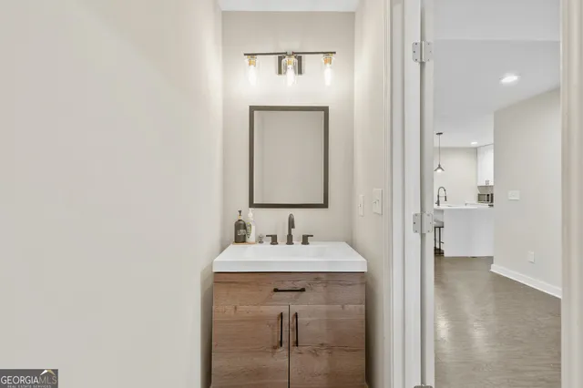 a bathroom with a sink and a mirror