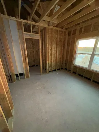 a view of an empty room with a fireplace