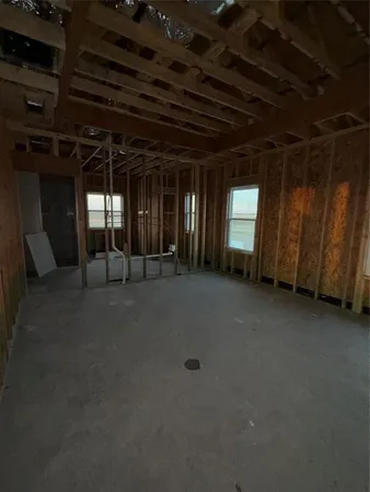 a view of a room with wooden walls