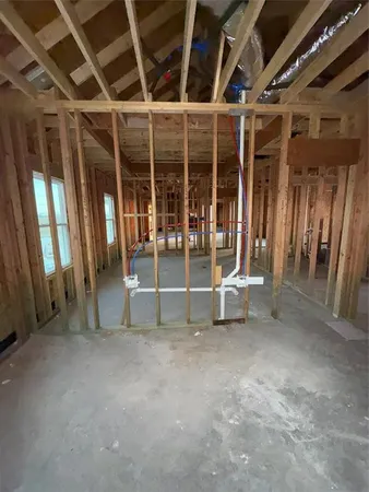 a view of an empty room with glass door