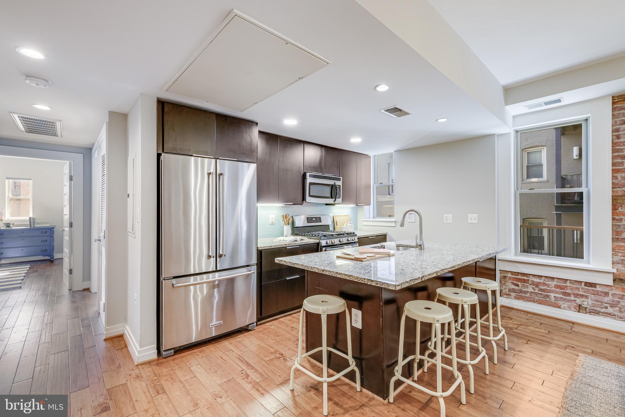 1801 Wyoming Avenue Northwest, Unit 22 Washington, DC 20009 - Photo 9 of 22 Kitchen with bar seating