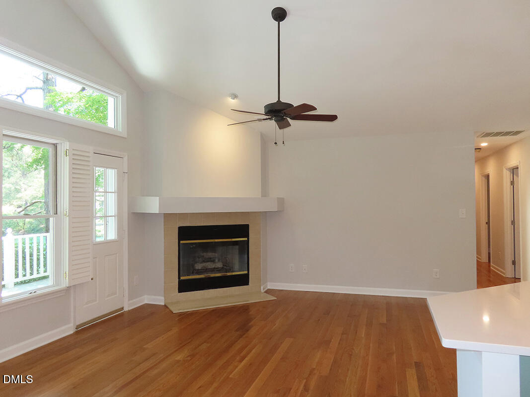 120 Weatherhill Point Carrboro, NC 27510 - Photo 2 of 25 a view of an empty room with a fireplace and a window