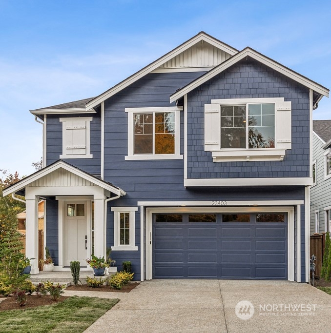23337 13th (lot 5) Avenue Southeast Bothell, WA 98021 - Photo 1 of 27 a front view of a house with a yard and garage