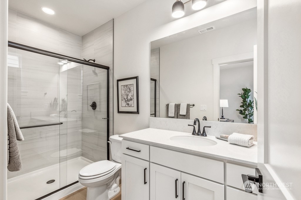 23337 13th (lot 5) Avenue Southeast Bothell, WA 98021 - Photo 14 of 27 a bathroom with a sink toilet and shower