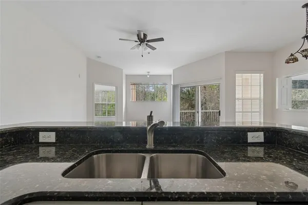 a kitchen with a sink and a window