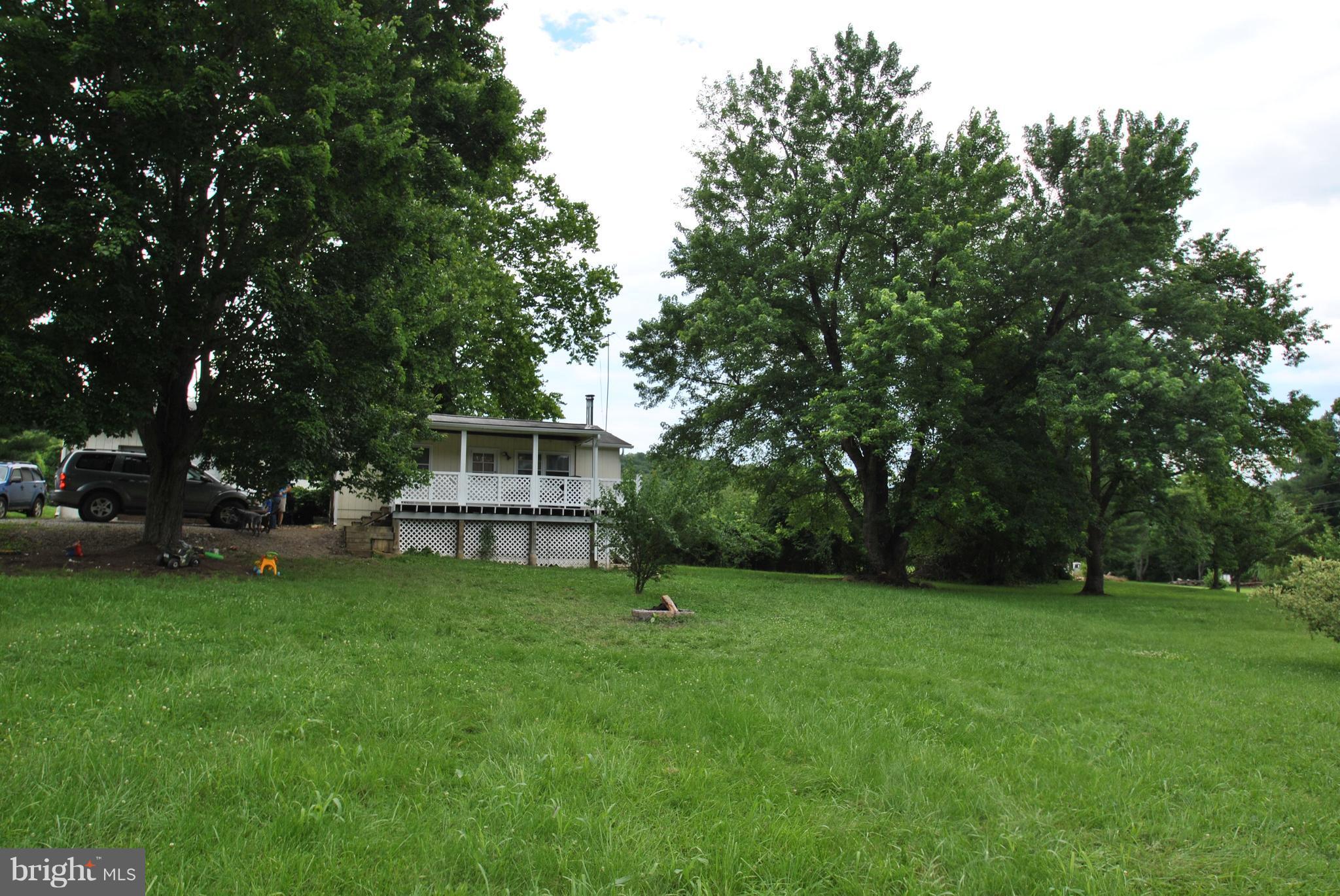 5930 Howellsville Road Front Royal, VA 22630 - Photo 18 of 22 a big yard with large trees