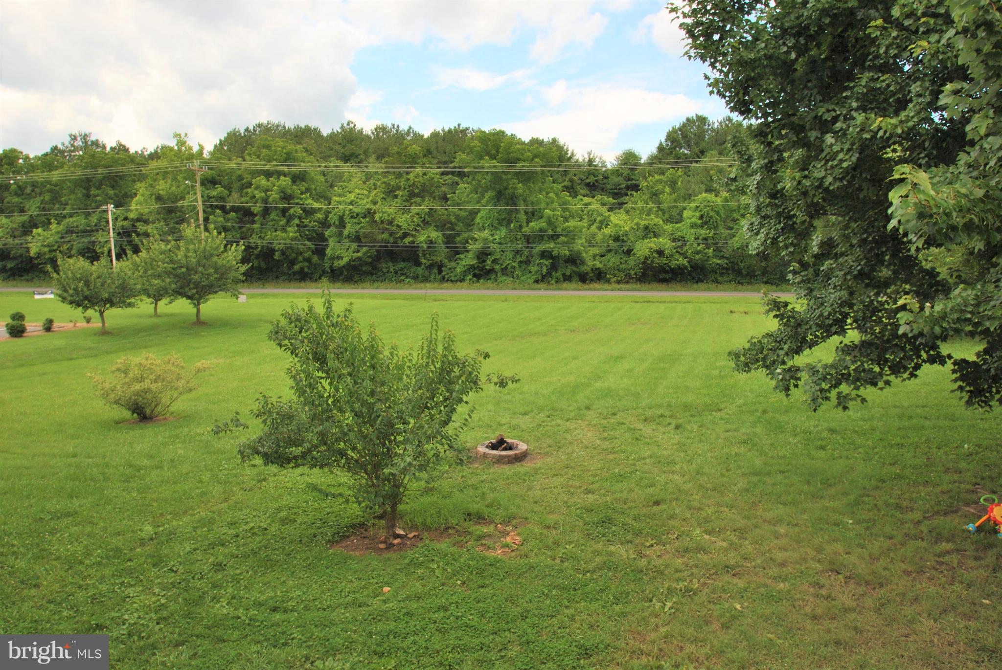 5930 Howellsville Road Front Royal, VA 22630 - Photo 22 of 22 a view of a garden with a building in the background