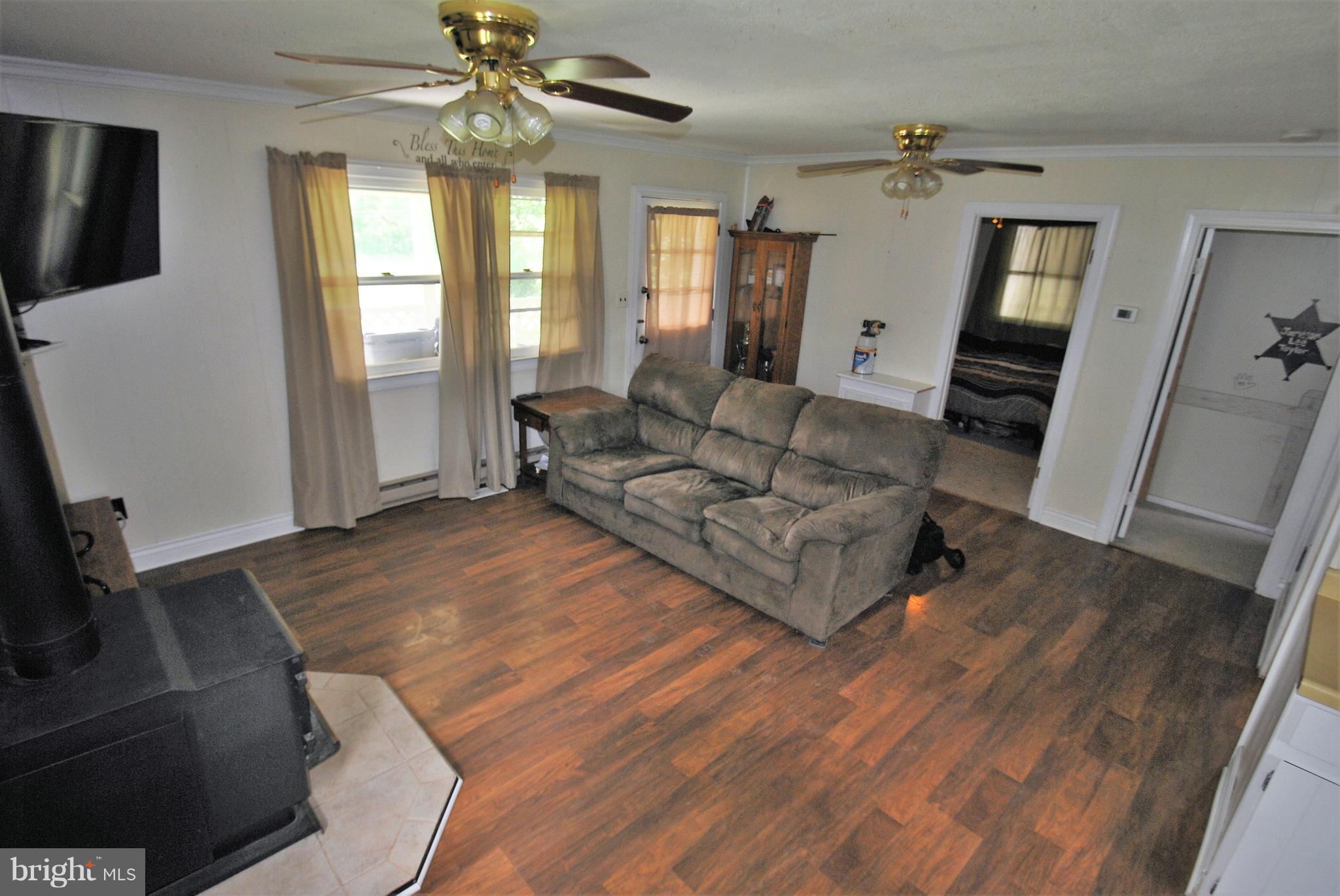 5930 Howellsville Road Front Royal, VA 22630 - Photo 5 of 22 a living room with furniture and a flat screen tv