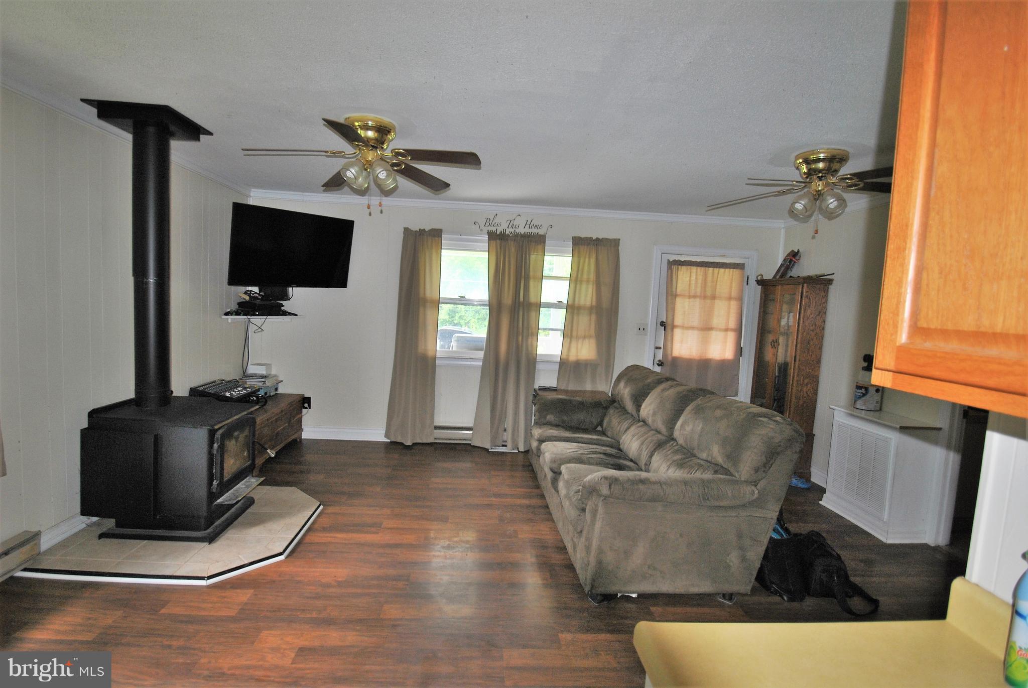 5930 Howellsville Road Front Royal, VA 22630 - Photo 6 of 22 a living room with furniture a flat screen tv and a window