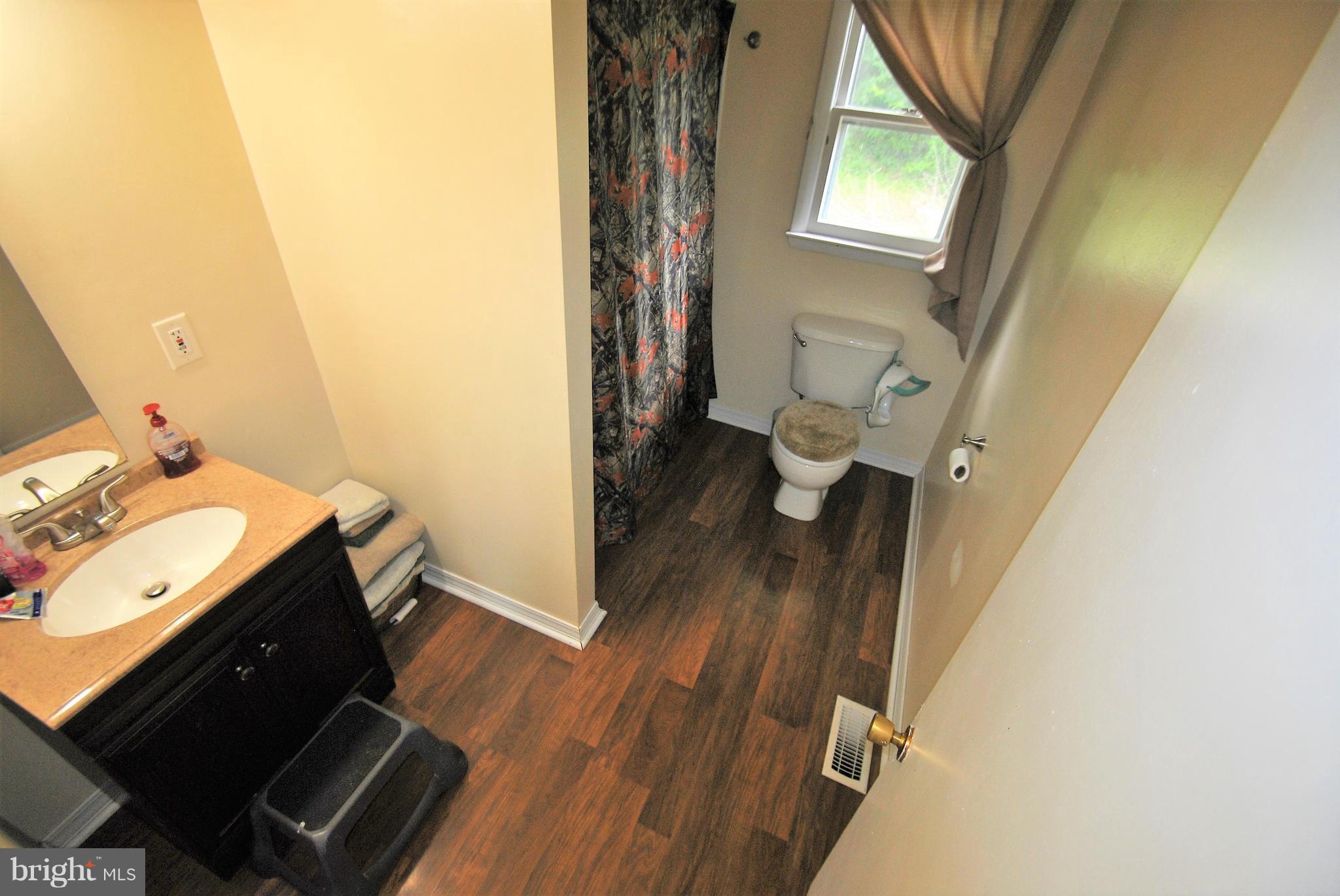 5930 Howellsville Road Front Royal, VA 22630 - Photo 7 of 22 a view of a bathroom with a sink and a mirror