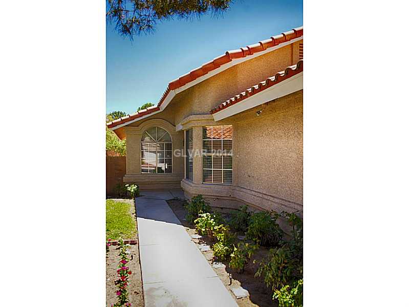 2805 Mirage Road Henderson, NV 89074 - Photo 3 of 34 Facade/Exterior Front. Trimmed bushes line the sidewalk as well.